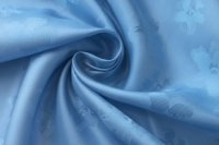 ткань подклад голубого цвета с жаккардовыми цветами