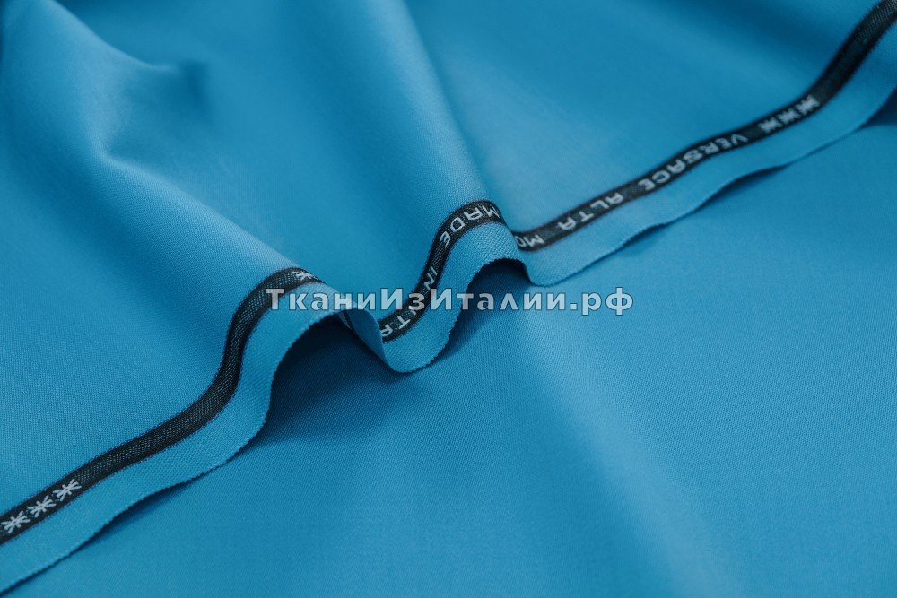ткань шерстяная ткань с эластаном  цвета голубого неба, костюмно-плательная шерсть однотонная голубая Италия